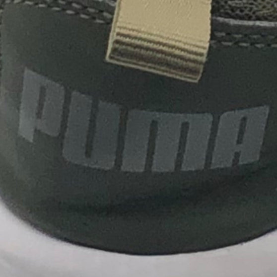 Close-up of a Puma sneaker with a focus on the brand logo.